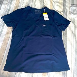 Woman’s Fig’s Catarina one-pocket scrub top in Navy. Size Medium.